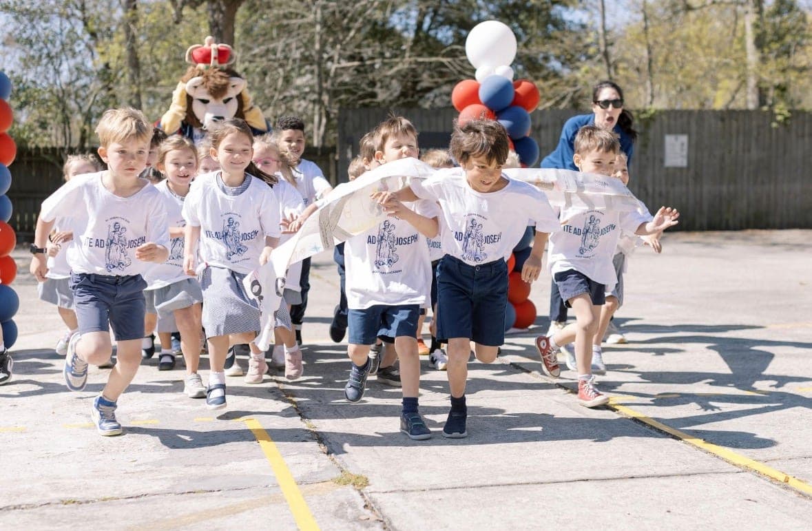 Holy Family Academy students setting off at the start of a past Fun Run